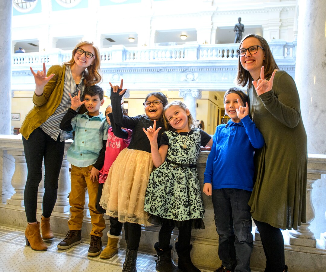 (Steve Griffin  |  The Salt Lake Tribune)  Mercy Persinger, right, with her first grade students for the Jean Massieu School of the Deaf get their photograph taken as the visit the State capitol during the Utah Schools for the Deaf and Blind "Kids in the Classroom at the Capitol day" in Salt Lake City Thursday February 8, 2018.