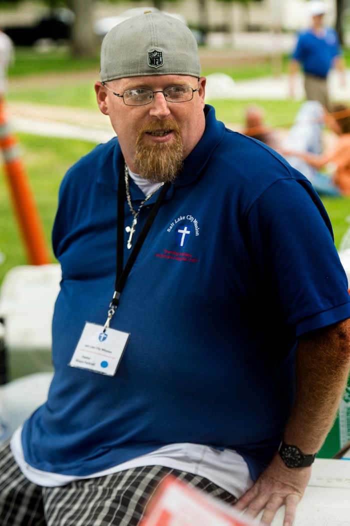 (Rick Egan  |  The Salt Lake Tribune)      
Pastor Shawn Fackrell Pioneer assists the Salt Lake City Mission as they feed and donated clothes to the homeless in Pioneer Park, Monday, May 28, 2018.