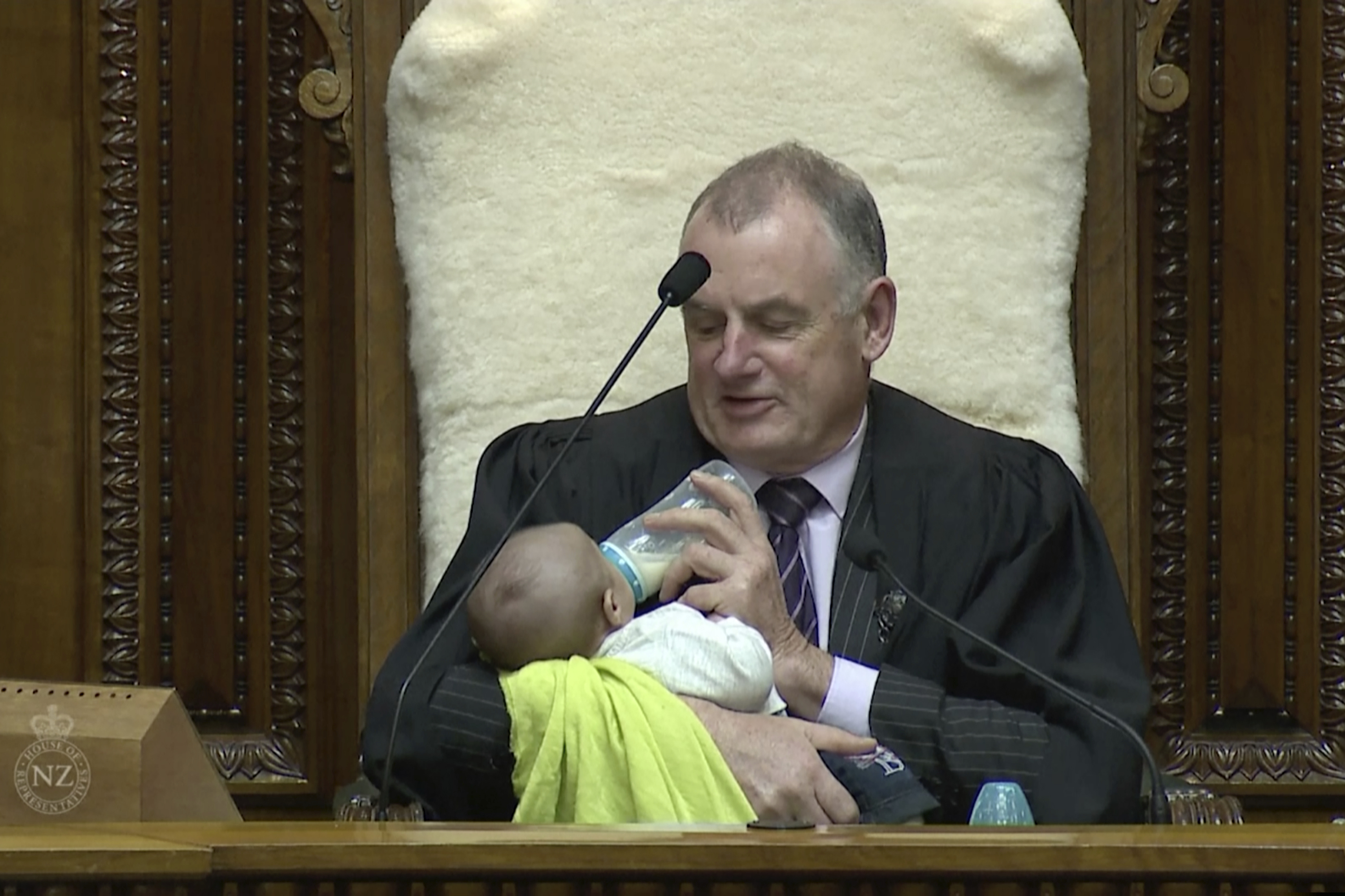(Parliament TV via AP)
In this Aug. 21, 2019, image from video, New Zealand House Speaker Trevor Mallard bottle-feeds lawmaker Tamati Coffey's baby, Tutanekai Smith-Coffey, while presiding over a debate in parliament in Wellington, New Zealand. Mallard said he’s been trying to make Parliament a more baby-friendly place.