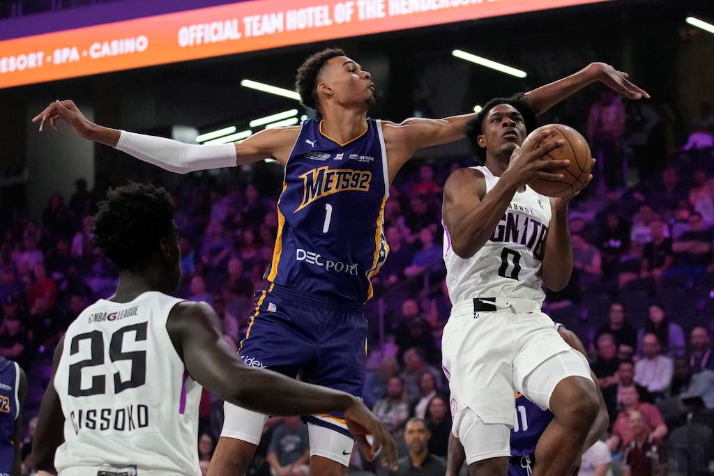 (John Locher | AP) Boulogne-Levallois Metropolitans 92's Victor Wembanyama, center, guards NBA G League Ignite's Scoot Henderson, right, during the first half of an exhibition basketball game Tuesday, Oct. 4, 2022, in Henderson, Nev.