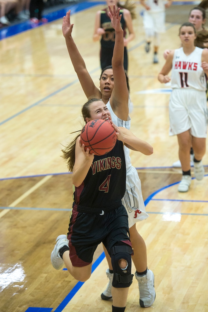 (Chris Detrick | The Salt Lake Tribune) Viewmont's Mckenna Morris (4) shoots past Alta's Julia Folau (25) during the game at Pleasant Grove High School Thursday, November 30, 2017. Viewmont defeated Alta 65-44.