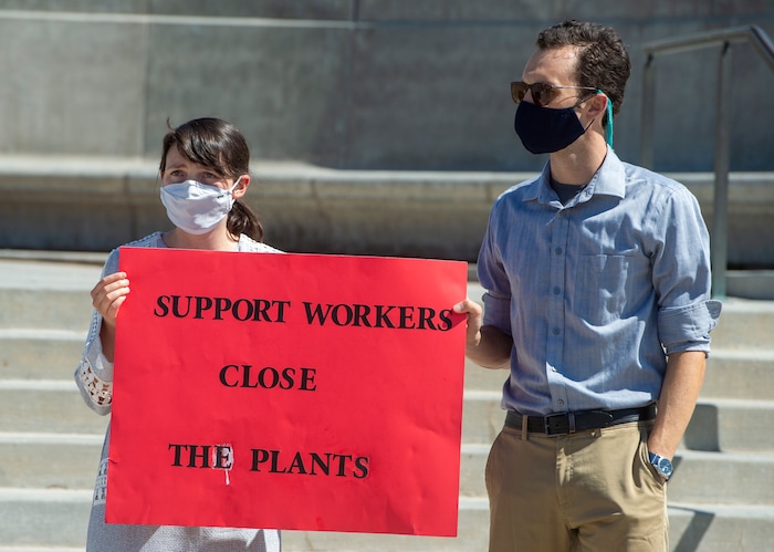 (Rick Egan | The Salt Lake Tribune) Christiana Johnson and Chris Shapard join a protest at the State Capitol, as the p\Physicians Committee for Responsible Medicine is asking Gov. Herbert to close meatpacking plants in the state to slow the spread of the coronavirus, Thursday, July 30, 2020.