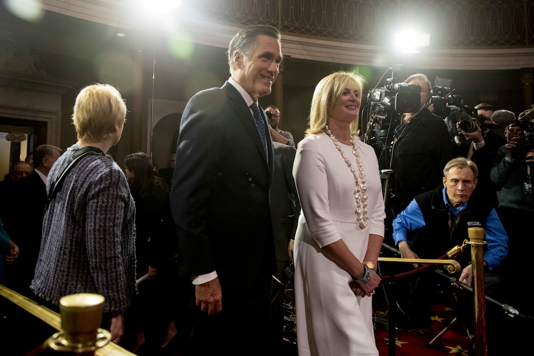 Sen. Mitt Romney, R-Utah, and his wife Ann arrive for a mock swearing in ceremony in the Old Senate Chamber on Capitol Hill in Washington, Thursday, Jan. 3, 2019, as the 116th Congress begins. (AP Photo/Andrew Harnik)