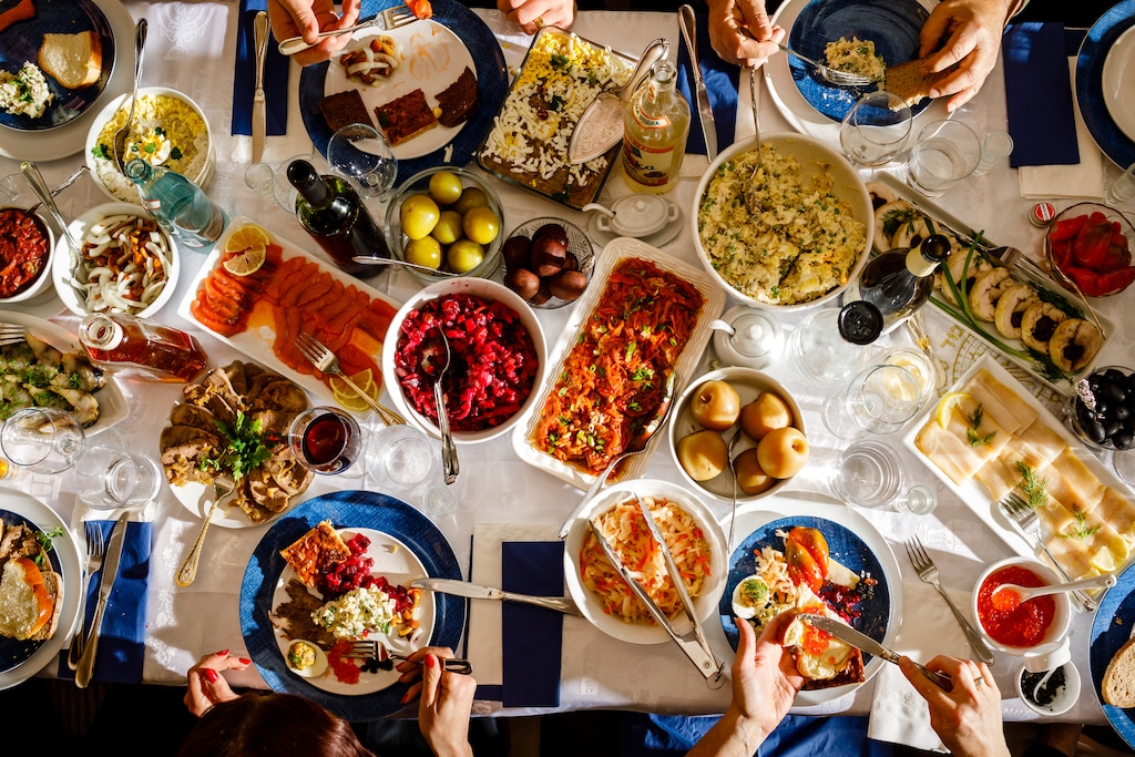 (Leah Nash | The New York Times) This holiday feast features Russian food. Latter-day Saints, columnist Eli McCann writes, tend to make to much for special occasions because they fear running out of food more than wasting it.