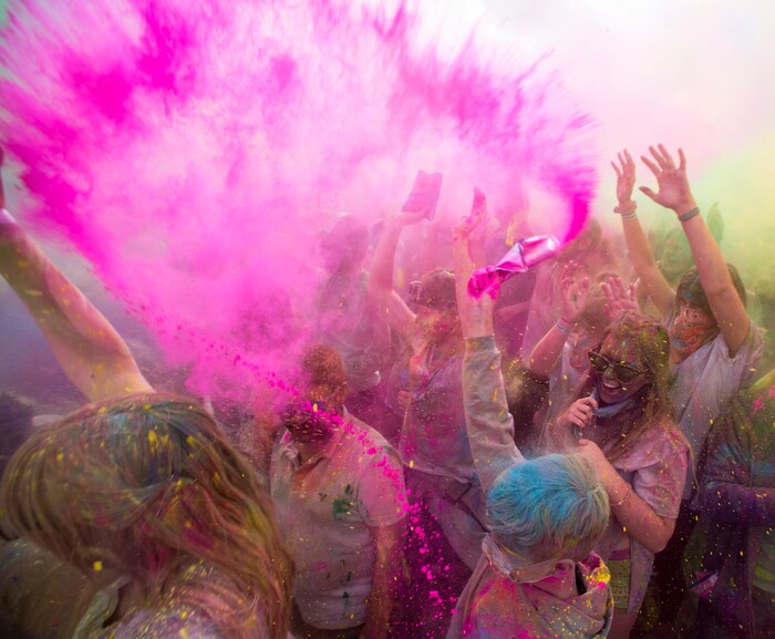 (Rick Egan  |  The Salt Lake Tribune)     Revelers celebrate spring as they toss colored powder into the air, during the 22nd annual Holi Festival of Colors at the Sri Sri Radha Krishna Temple in Spanish Fork, Saturday, March 24, 2018. The festival which celebrates the beginning or spring is also known as at the Festival of Love.