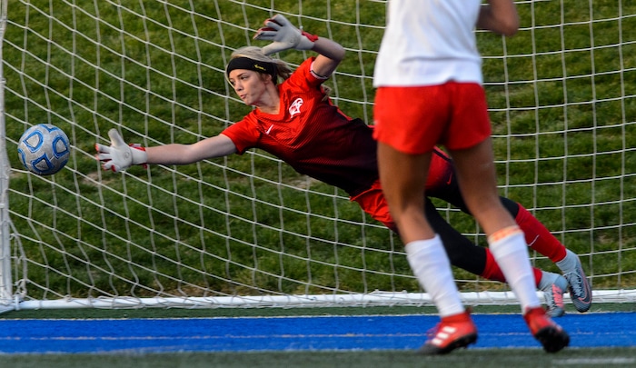 (Steve Griffin | The Salt Lake Tribune) Maple Mountain's Kayla Thompson stretches for a penalty kick during shootout against East during 5A semifinal girl's soccer match at Juan Diego High School in Draper Tuesday October 17, 2017.