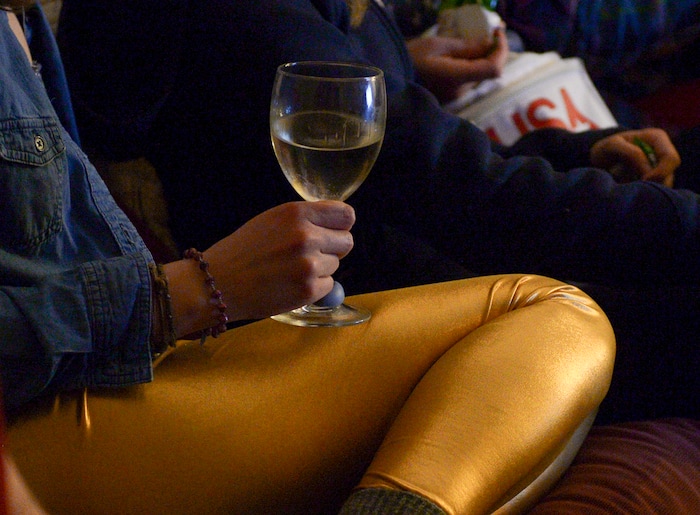 (Leah Hogsten | The Salt Lake Tribune) Rosanise Odell wears her "gold medal pants" in support of her friend first-time Olympian Darian Stevens. Westminster students and friends of first-time Olympian Darian Stevens gathered for a watch party in Sugar House to watch Stevens compete in her first qualifying ski slopestyle competition run Friday, Feb. 16, 2018. Stevens is a graduate of the Park City Winter Sports School and a business major at Westminster.