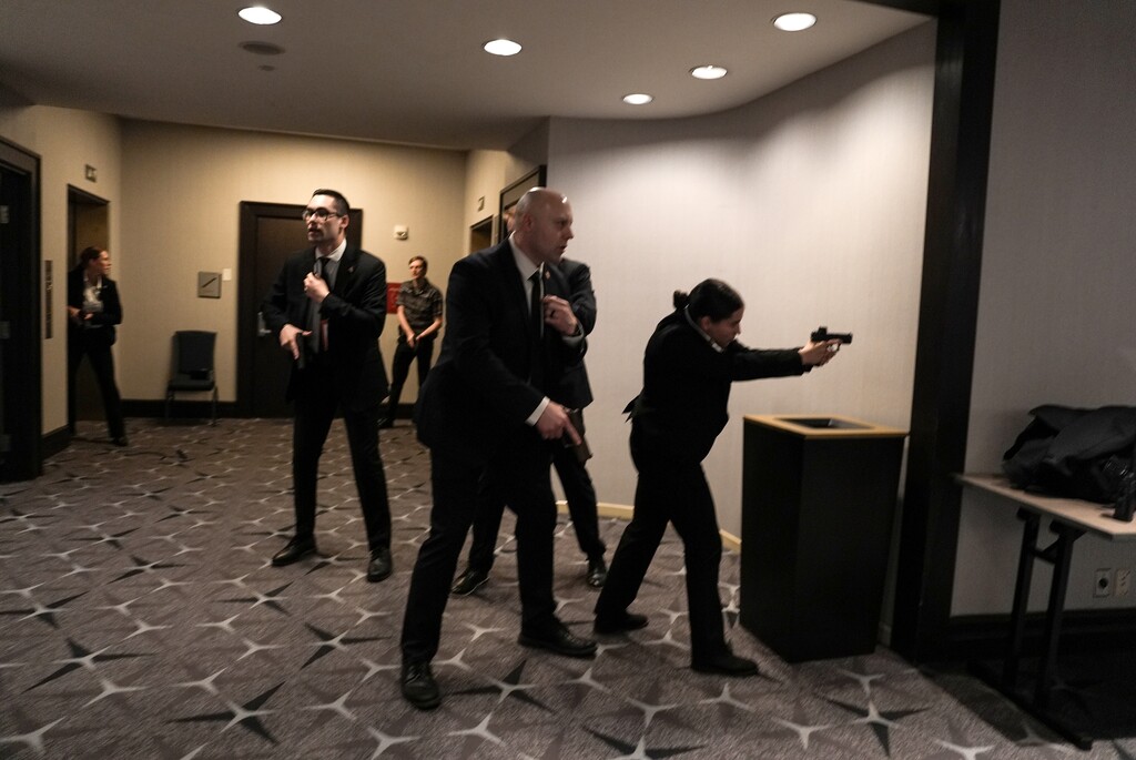 (Salwan Georges | The New York Times) Secret Service agents with drawn weapons at the Washington Hilton where the White House Correspondents’ Association dinner is held, in Washington on Saturday, April 25, 2026.