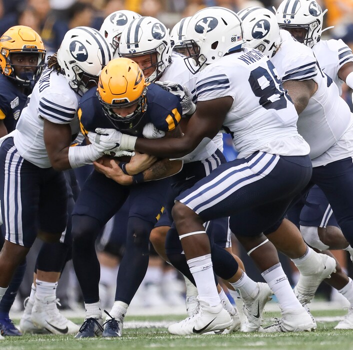 University of Toledo's quarterback Mitchell Guadagni (6) is brought down by a pack of Brigham Young's defense during a college football game at the Glass Bowl in Toledo, Ohio on Saturday,September 28, 2019. UT defeated BYU 28-21. (Rebecca Benson/ The Blade via AP)