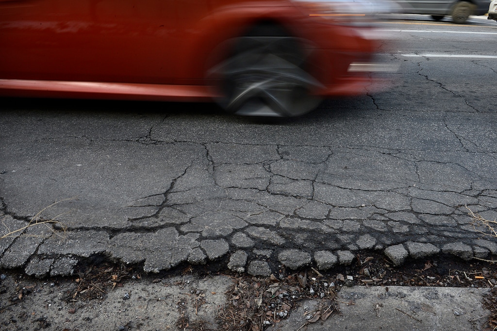Scott Sommerdorf | The Salt Lake Tribune  A section of damaged road on the south side of 100 South just west of University in Salt Lake City.