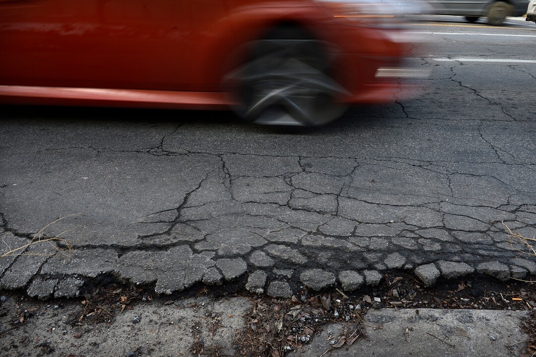 (Scott Sommerdorf   |  The Salt Lake Tribune)   A section of the damaged road on the south side of 100 South just west of University, Wednesday, January 24, 2018.