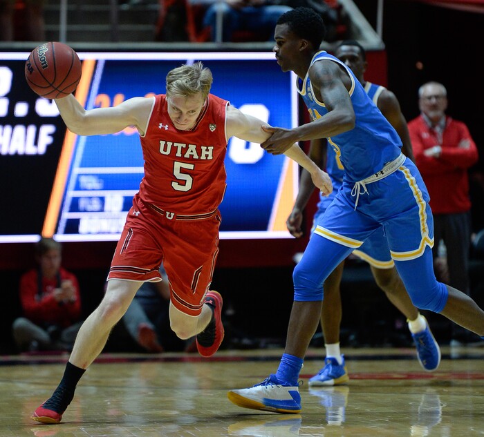 (Francisco Kjolseth  |  The Salt Lake Tribune)  Utah Utes guard Parker Van Dyke (5) is fouled in the final seconds of the game as the University of Utah hosts UCLA in NCAA basketball at the Huntsman Center in Salt Lake City, Thursday, Feb. 22, 2018.