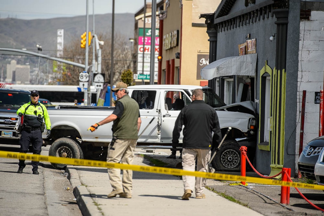 (Trent Nelson  |  The Salt Lake Tribune)  Law enforcement at the scene of a shootout near 3300 South State Street in South Salt Lake on Monday April 8, 2019.