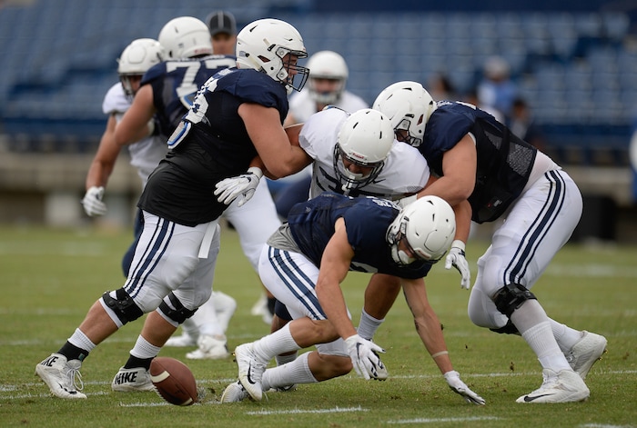 (Francisco Kjolseth  |  The Salt Lake Tribune)  Austin Kafentzis fumbles the ball as BYU holds a scrimmage at LaVell Edwards Stadium in Provo on Thursday, Aug. 10, 2017.