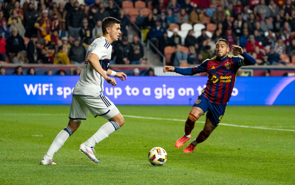Vancouver Whitecaps' defender, Ranko Veselinovic, left, controls the ball while Real Salt Lake's Cristian Arango, right, attempts to regain possession during the first half of an MLS soccer game on Saturday, Oct. 19, 2024 in Sandy. (AP Photo/Alex Benja)