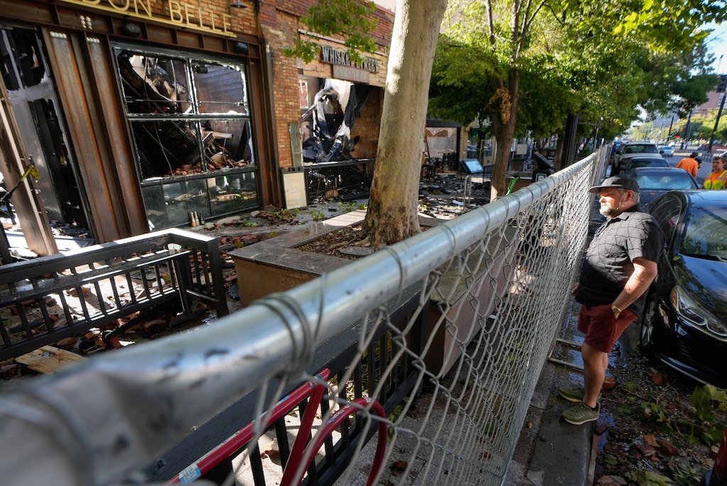 (Francisco Kjolseth | The Salt Lake Tribune) Charley Perry, owner of Eva which sits next door to businesses that burned along Main Street in Salt Lake City, says “I think we’re ok,” despite the catastrophic damage to the businesses of London Belle, Whiskey Street, White Horse and Los Tapatios, Tuesday, Aug. 12, 2025.