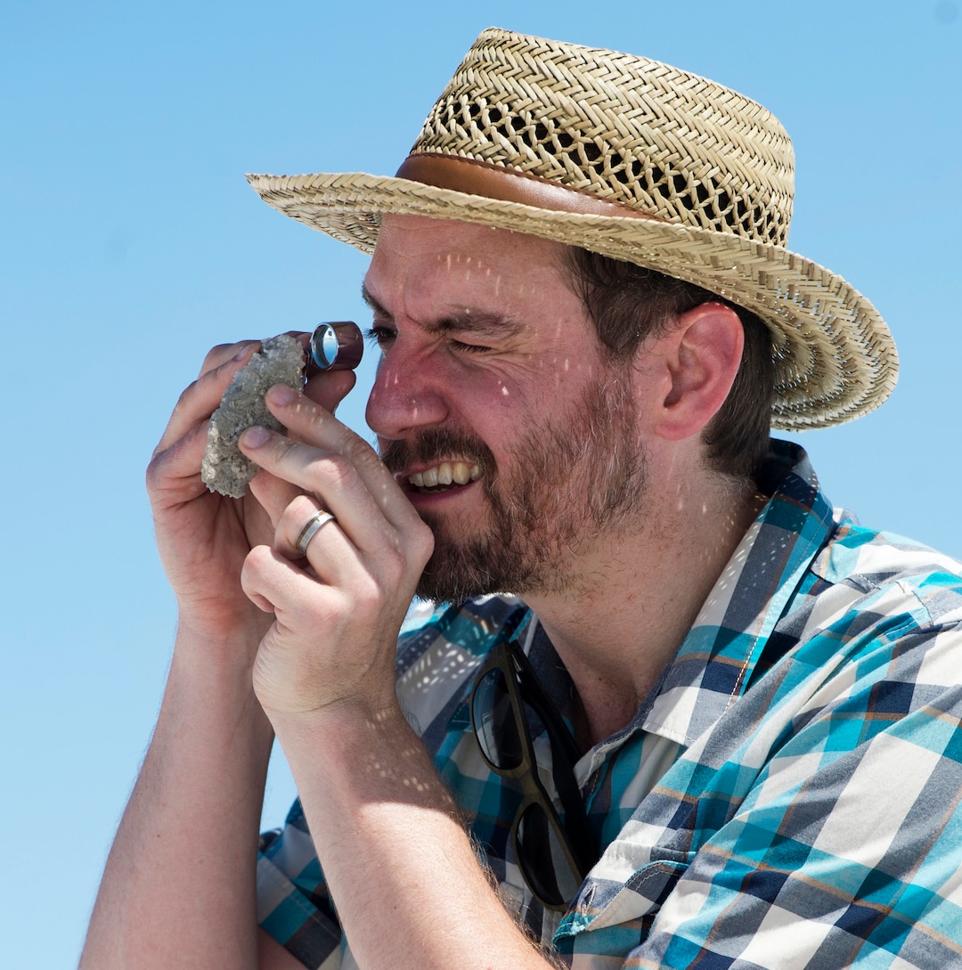 (Rick Egan  |  The Salt Lake Tribune)Ciaran Harman, asst. professor at John's Hopkins University, examines a sample of salt crust, on the Bonneville Salt Flats. Friday, August 11, 2017.