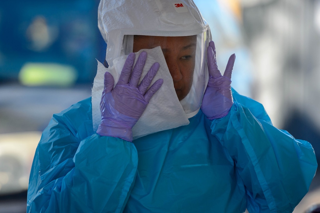 (Trent Nelson  |  The Salt Lake Tribune) Esther Ortiz working at a COVID-19 testing station at Rice-Eccles Stadium in Salt Lake City on Monday, Oct. 12, 2020.