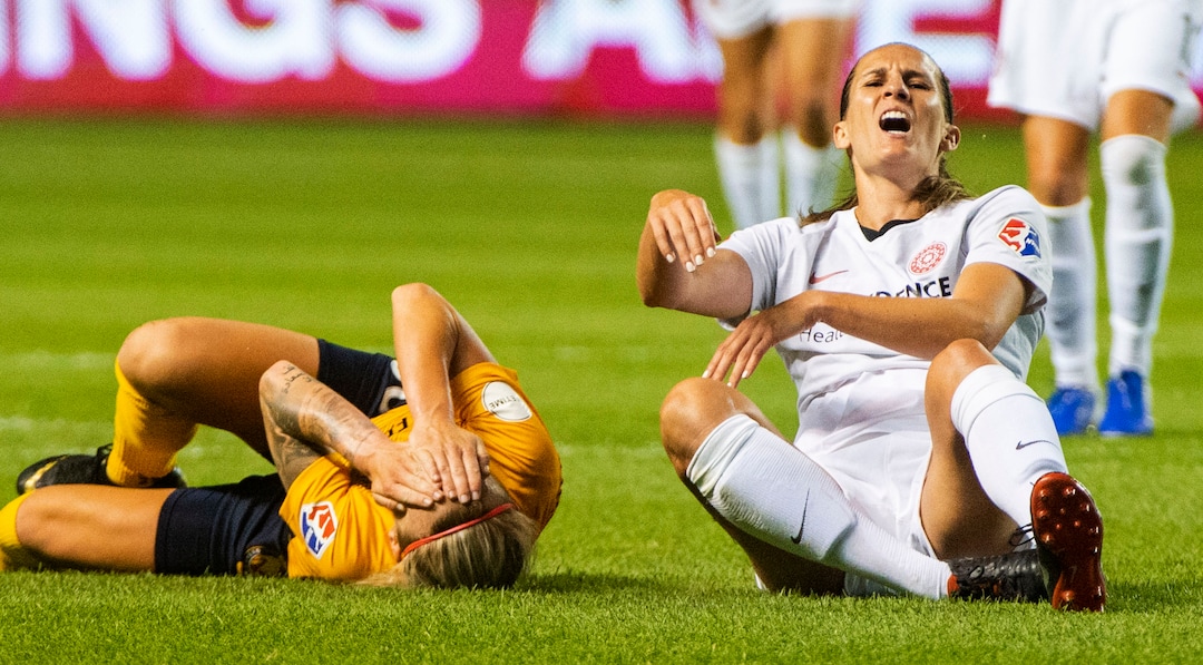 (Rick Egan  |  The Salt Lake Tribune)    Utah Royals FC midfielder Gunnhildur Jónsdóttir (66) collides with Portland Thorns FC defender Katherine Reynolds (2), in Soccer action between Utah Royals FC and Portland Thorns FC, in Sandy, Friday, July 19, 2019.
