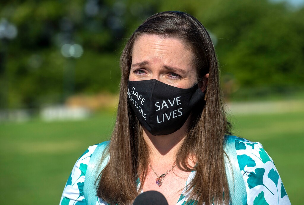(Rick Egan  |  The Salt Lake Tribune)   Protester Wendy Moss talks to the media during the Mask-In and Car Caravan protest at the State Capitol to demand the governor and other state and local leaders ensure that Utah schools protect students and staff when schools reopen, on Thursday, July 23, 2020.