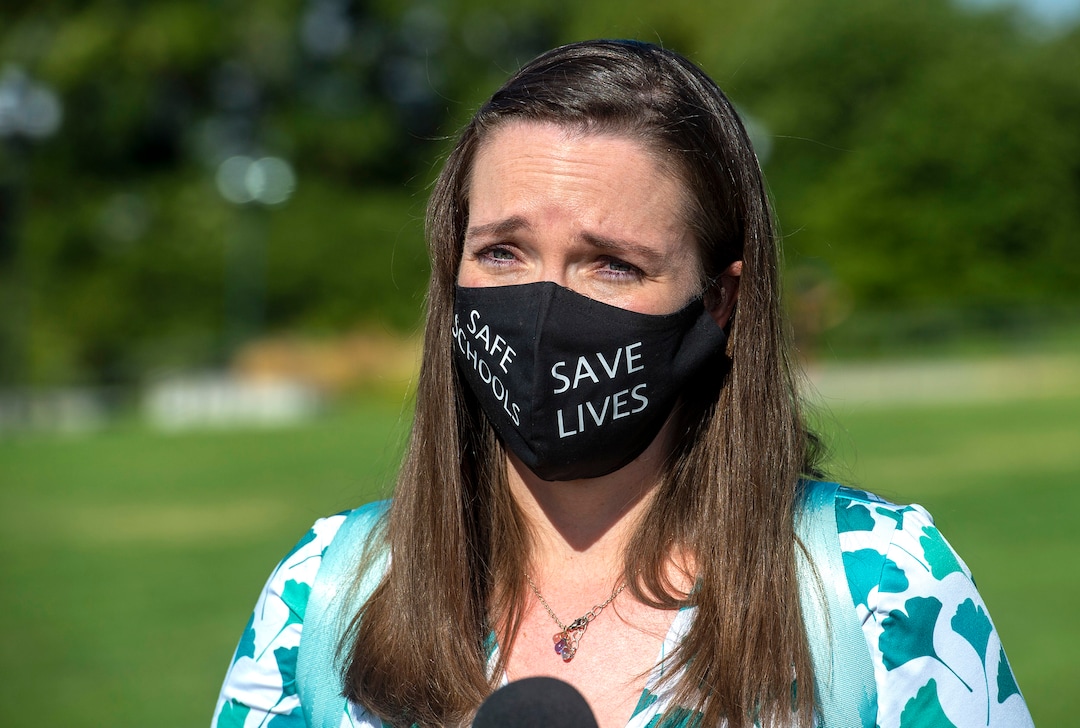 (Rick Egan  |  The Salt Lake Tribune)   Protester Wendy Moss, talks to the media, during the Mask-In and Car Caravan protest at the State Capitol to demand the Governor and other state and local leaders ensure that Utah school protect students and staff when schools reopen, on Thursday, July 23, 2020.