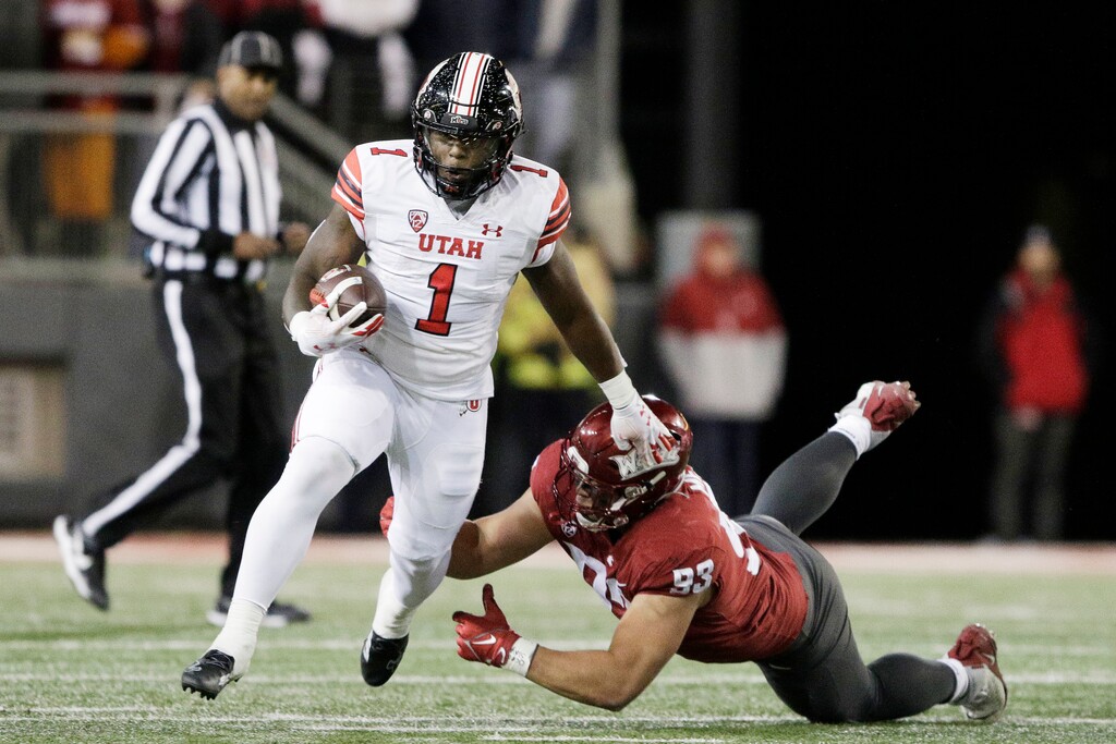 (Young Kwak | AP) Utah running back Jaylon Glover (1) gets past Washington State defensive lineman Christian Mejia (93) during the first half of an NCAA college football game, Thursday, Oct. 27, 2022, in Pullman, Wash.