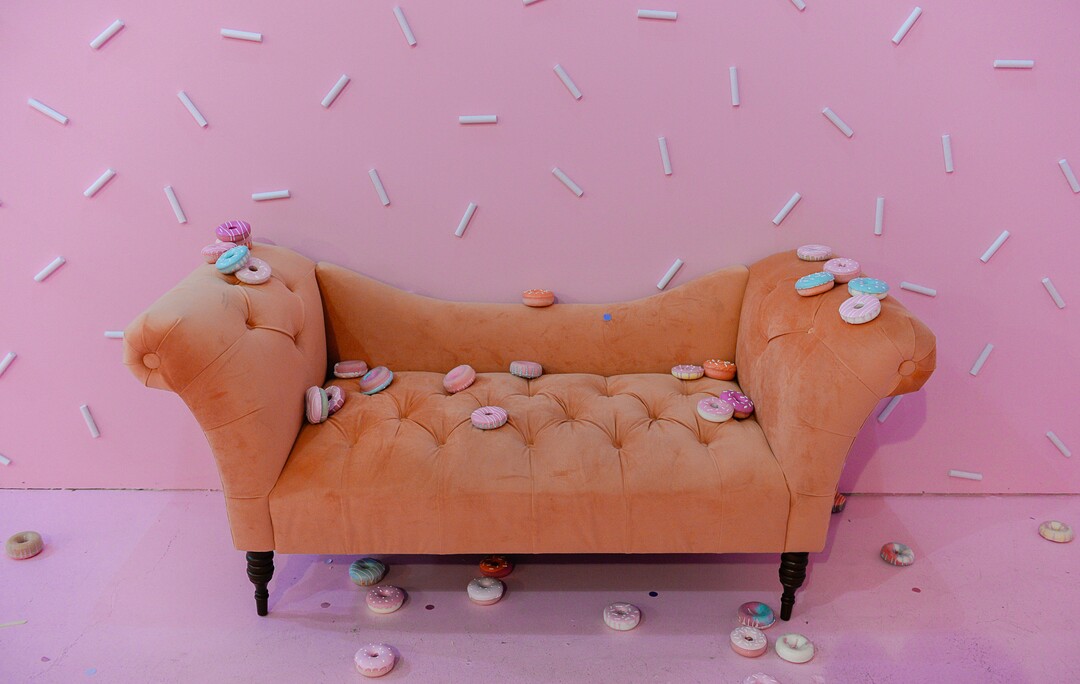 (Francisco Kjolseth  |  The Salt Lake Tribune) Lounge on a couch — surrounded by sprinkles — in the donut room at  Hall of Breakfast, a quirky new art exhibit that celebrates the first meal of the day.