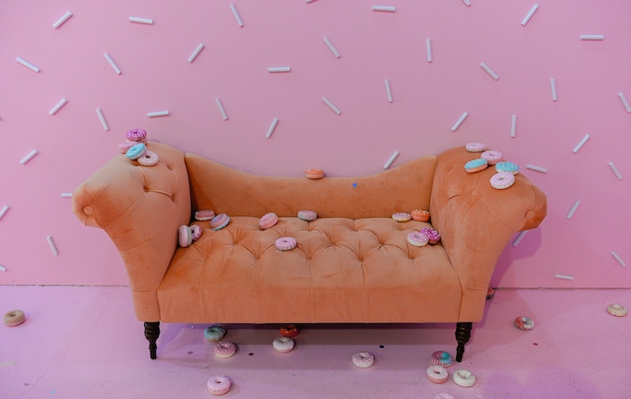 (Francisco Kjolseth  |  The Salt Lake Tribune) Lounge on a couch — surrounded by sprinkles — in the donut room at  Hall of Breakfast, a quirky new art exhibit that celebrates the first meal of the day.