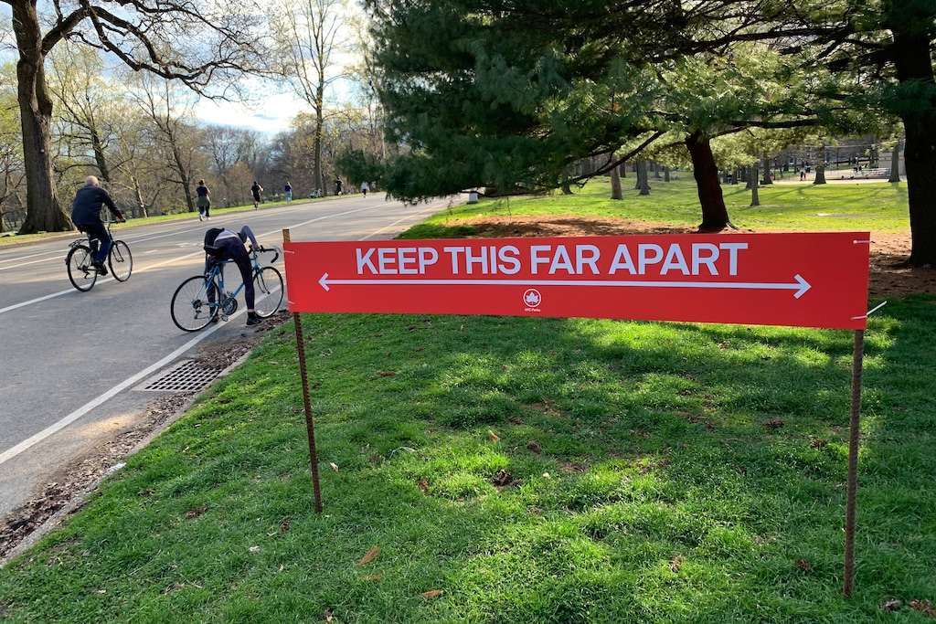 (Wong Maye-E | AP) Signage urging social distancing is seen in Prospect Park in the Brooklyn borough of New York, Wednesday, April 8, 2020. While New York Gov. Andrew Cuomo said New York could be reaching a "plateau" in hospitalizations, he warned that gains are dependent on people continuing to practice social distancing.