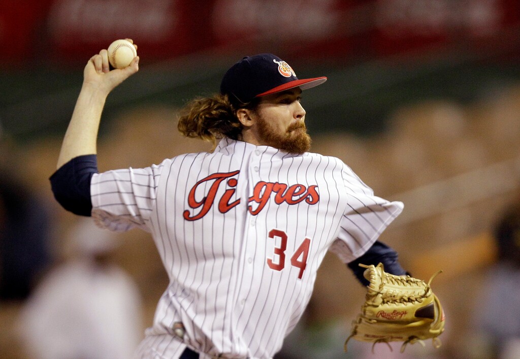 FILE - In this Feb. 3, 2012, file photo, Venezuela's starting pitcher Tyson Brummett throws in the first inning against against Dominican Republic at a Caribbean Series baseball game at Quisqueya stadium in Santo Domingo, Dominican Republic. Former Philadelphia Phillies pitcher Brummett and three others died in a plane crash in rural Utah. The Utah County Sheriff’s Office says ex-pitcher 35-year-old Brummett of Salt Lake City was flying the small plane, which crashed near Box Elder Peak in American Fork Canyon just before 8 a.m. Friday, July 3, 2020. (AP Photo/Fernando Llano, File)
