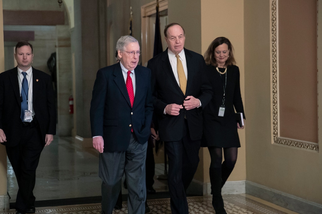 (AP Photo/J. Scott Applewhite) En route to a meeting at the White House, Senate Majority Leader Mitch McConnell, R-Ky., left, walks with Sen. Richard C. Shelby, R-Ala., chairman of the Senate Appropriations Committee, as work continues prior to a Friday night funding deadline to avoid a partial government shutdown, in Washington, Friday, Dec. 21, 2018. Trump is imploring McConnell to change the Senate's rules in order to pass the spending bill with money for a border wall.