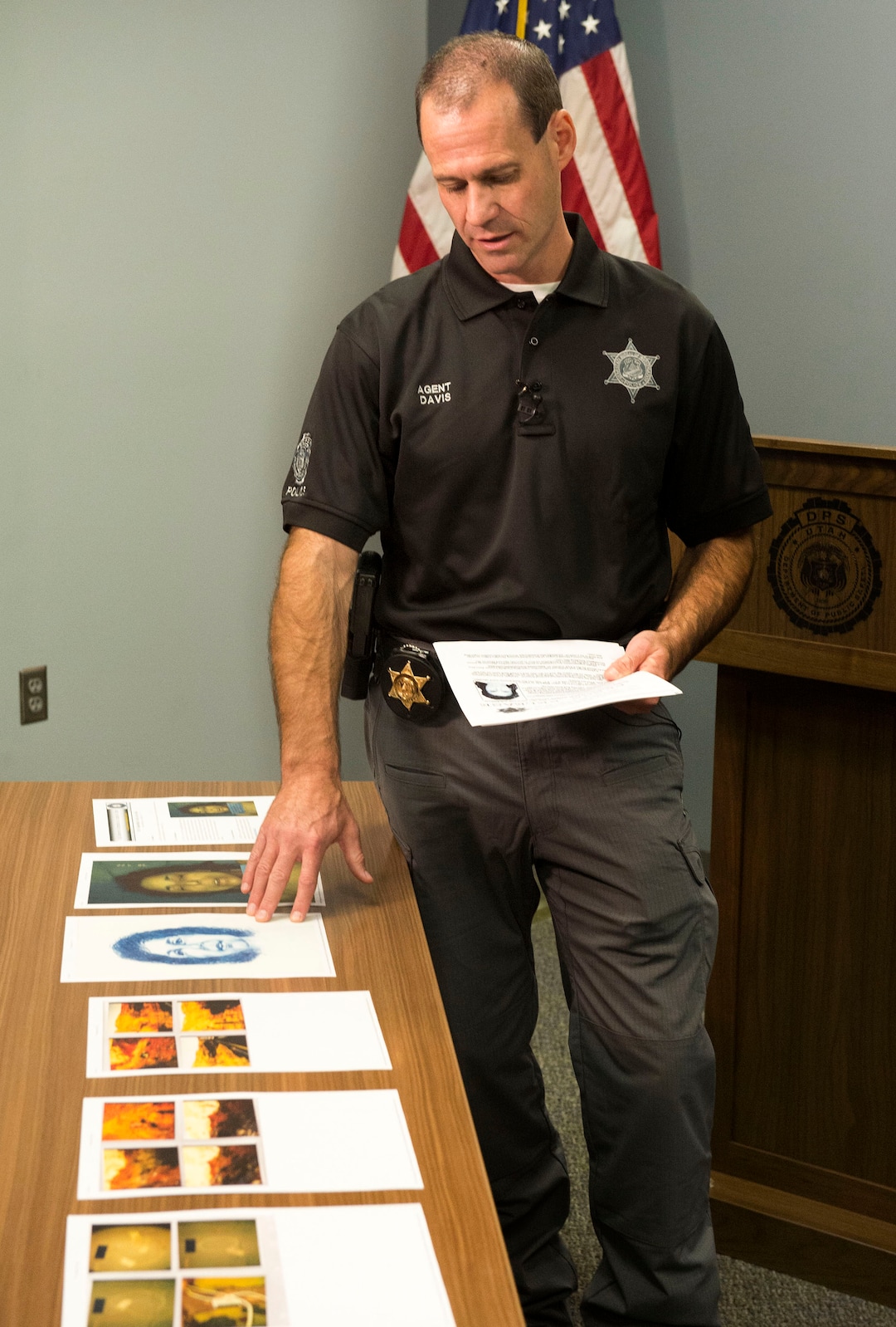 (Rick Egan  |  The Salt Lake Tribune)   Agent Brian Davis, from the Department of Public Safety, displays photos of the victim, as he asks for the public’s help identifying a murder victim in a cold case homicide from April 1998, during a news conference, Tuesday, Oct. 2, 2018.