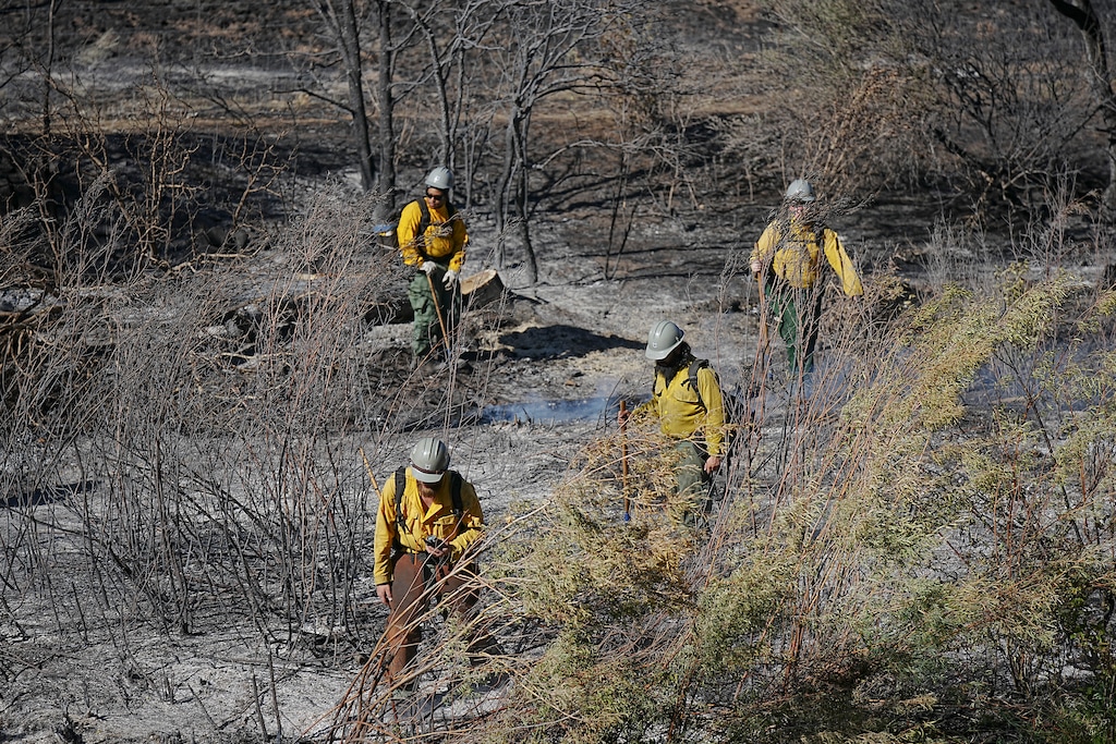 (Bethany Baker | The Salt Lake Tribune) Firefighters inspect part of the burn scare for the Broad Fire at the mouth of the Weber Canyon near South Weber on Saturday, Sept. 5, 2026.