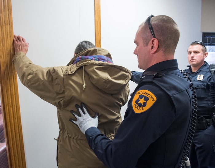(Rick Egan  |  The Salt Lake Tribune)

Jackie Sanchez is frisked by the Salt Lake City police, at his attorney's  2nd floor office after media conference about an abuse of force claim to be filed against the Salt Lake City Police, when Sanchez was attacked by a police dog on July 28. Wednesday, December 6, 2017.


