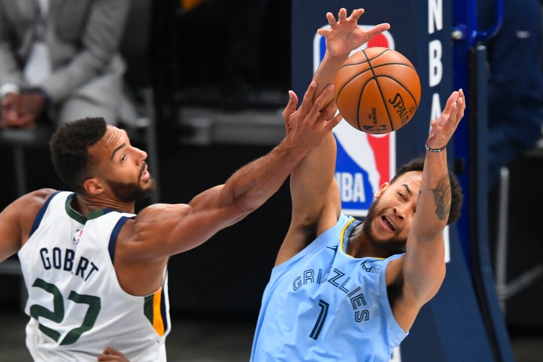 Memphis Grizzlies forward Kyle Anderson (1) and Utah Jazz center Rudy Gobert (27) vie for a rebound during the first half of Game 3 of an NBA basketball first-round playoff series Saturday, May 29, 2021, in Memphis, Tenn. (AP Photo/John Amis)