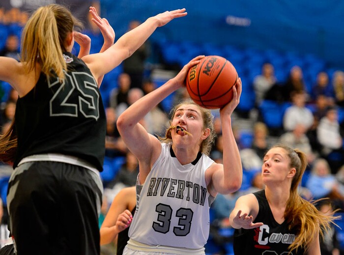 (Trent Nelson | The Salt Lake Tribune)  Riverton's Morgan Kane (33) defended by American Fork's Halle Nelson (25)  and American Fork's Jamie Shepherd (22) as Riverton faces American Fork in the 6A High School Girls' Basketball Tournament at SLCC in Taylorsville, Tuesday Feb. 20, 2018.
