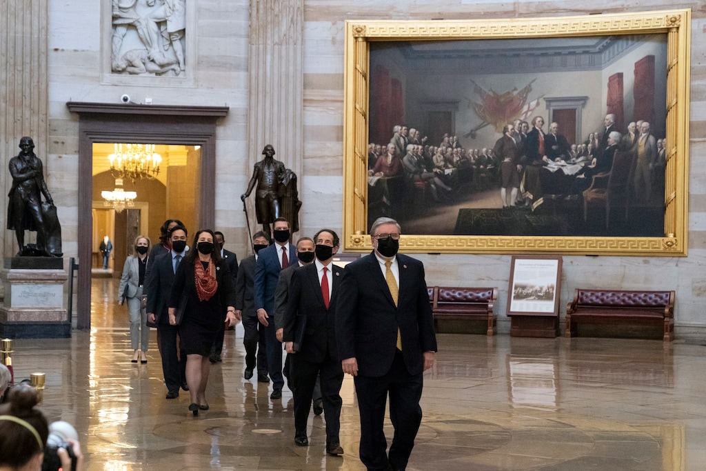 (Alex Brandon | AP photo)
Acting Sergeant at Arms Timothy Blodgett, right, leads Rep. Jamie Raskin, D-Md., second from right, the lead Democratic House impeachment manager, and other impeachment managers, through the Rotunda to the Senate for the second impeachment trial of former President Donald Trump, Tuesday, Feb. 9, 2021, in Washington.