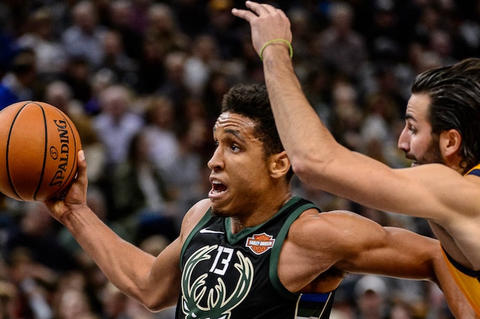 (Trent Nelson | The Salt Lake Tribune)  Milwaukee Bucks guard Malcolm Brogdon (13) drives past Utah Jazz guard Ricky Rubio (3) as the Utah Jazz host the Milwaukee Bucks, NBA basketball in Salt Lake City Saturday November 25, 2017.
