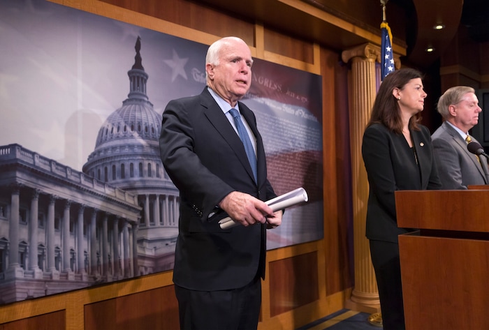 FILE - In this Feb. 24, 2016 file photo, Senate Armed Services Committee Chairman Sen. John McCain, R-Ariz., left, accompanied by committee members Sen. Kelly Ayotte, R-N.H., center, and Sen. Lindsey Graham, R-S.C., participate in a news conference on Capitol Hill in Washington. The Senate has rejected an effort to add nearly $18 billion to the Pentagon's budget for additional weapons and troops. The measure fell four votes short as senators shot down the plan crafted McCain.  (AP Photo/J. Scott Applewhite, File)