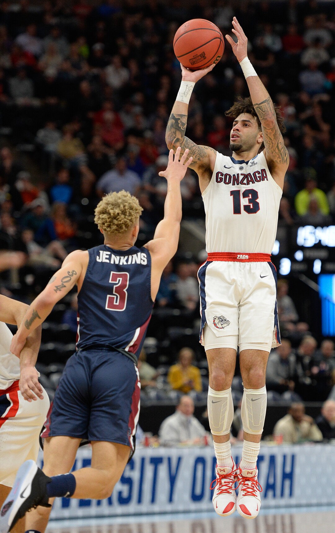 (Francisco Kjolseth  |  The Salt Lake Tribune)  Fairleigh Dickinson Knights guard Jahlil Jenkins (3) tries to block a three pointer by Gonzaga Bulldogs guard Josh Perkins (13) as Gonzaga faces Fairleigh Dickinson in their first round menÕs NCAA March Madness tournament game at Vivint Smart Home Arena in Salt Lake City on Thursday, March 21, 2019.