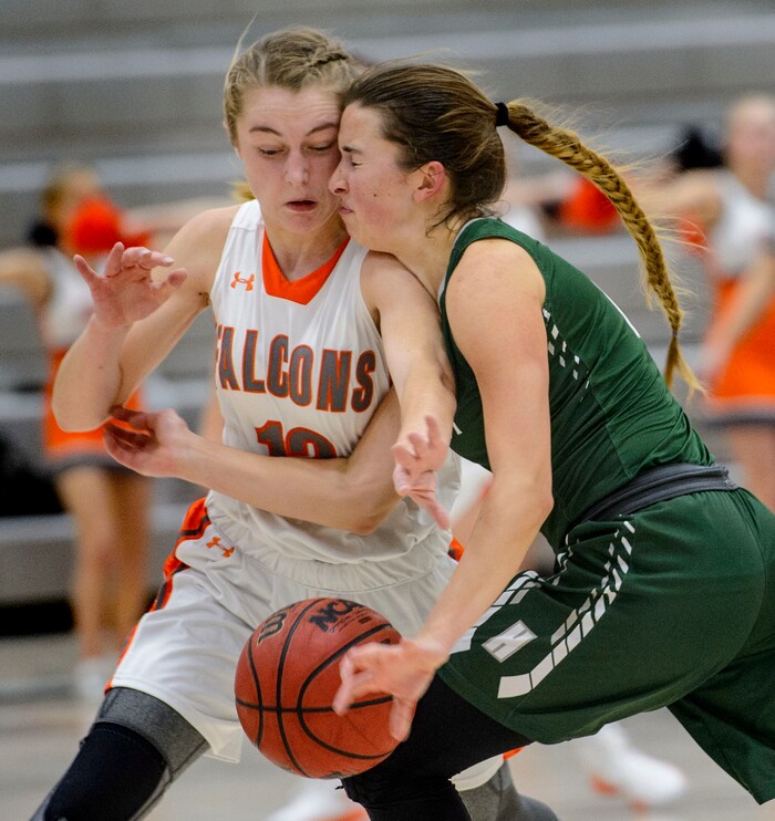 (Steve Griffin  |  The Salt Lake Tribune)  Hillcrest's Gabrielle Desjardins, right, crashes into Skyridge's  Ally Blackham during game at Skyridge High School in Lehi Wednesday December 13, 2017.