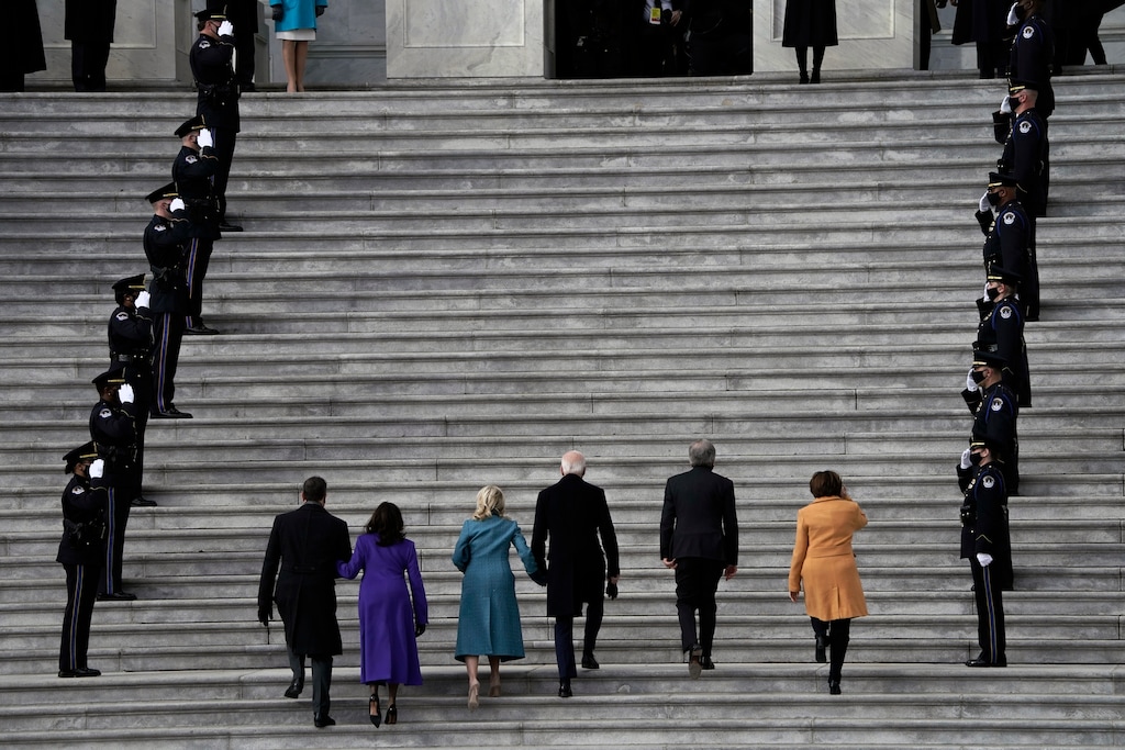 (Amr Alfiky | The New York Times)

President-elect Joe Biden, center, holds hands with his wife, Jill Biden, as they and Vice President-elect Kamala Harris, second from left, and her husband, Doug Emhoff, are received at the U.S. Capitol by Sen. Amy Klobuchar (D-Minn.), right, and Sen. Roy Blunt (R-Mo.) on Inauguration Day, Jan. 20, 2021. "Taking office at a low point means that the new president might be able to claim progress without superhuman effort," writes New York Times columnist Ross Douthat.