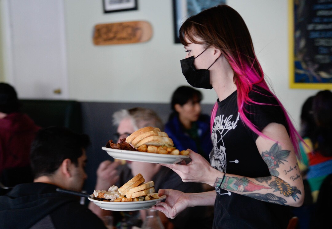 (Francisco Kjolseth  | The Salt Lake Tribune) Leslie Powers delivers breakfast plates at Salt Lake City's Blue Plate Diner on Friday, March 12, 2021. The owners recently announced they will be closing on May 4, after 20 years in business. A new development is going in on the corner that is forcing it to shut down.