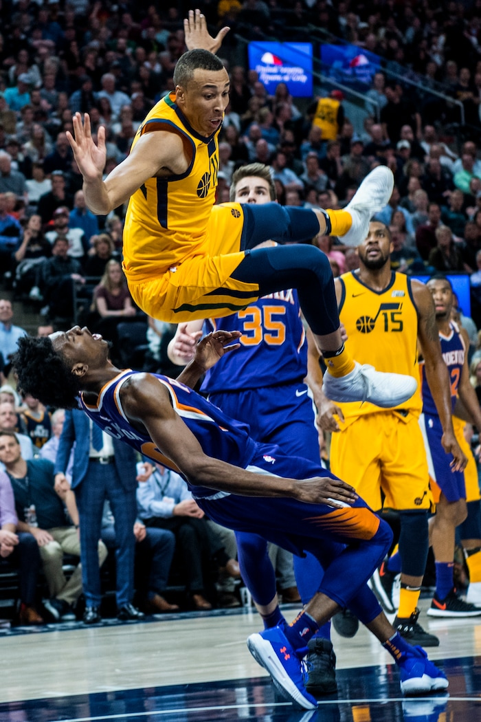 (Chris Detrick  |  The Salt Lake Tribune)  Utah Jazz guard Dante Exum (11) fouls Phoenix Suns guard Josh Jackson (20) during the game at Vivint Smart Home Arena Thursday, March 15, 2018. Utah Jazz defeated Phoenix Suns 116-88.