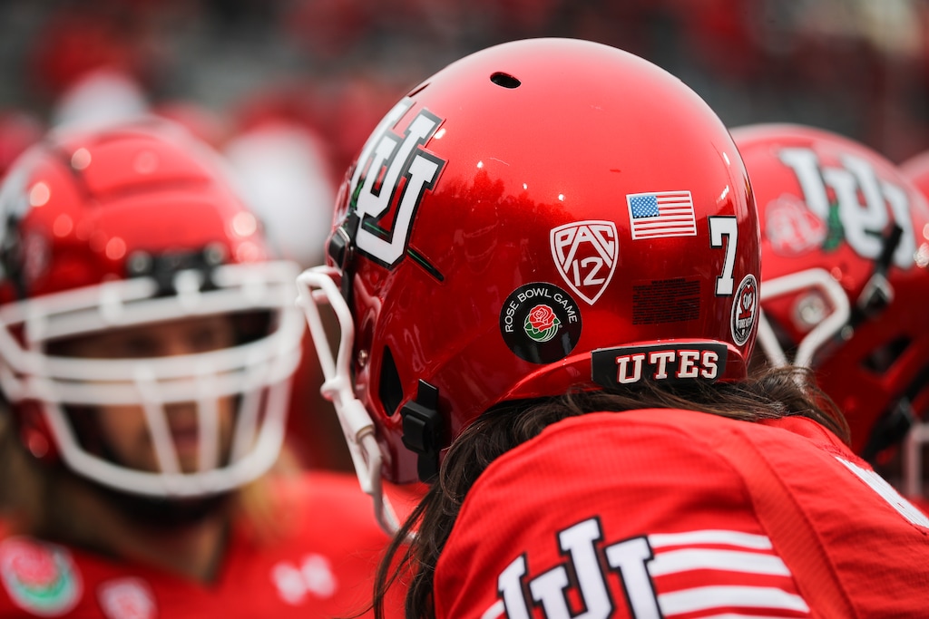 (Meg Oliphant | Special to The Tribune) Utah quarterback Cameron Rising (7) talks with his teammates ahead of the game against the Penn State Nittany Lions at Rose Bowl Stadium on Jan. 2, 2023 in Pasadena, Calif.