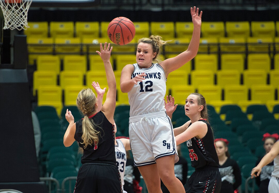 Scott Sommerdorf | The Salt Lake TribuneLauren Gustin swats away a pass during second half play. Gustin grabbed the ball and drove down the court for a layup. Salem Hills beat Hurricane 57-35 for the 4A girl's title, Saturday, March 3, 2018.