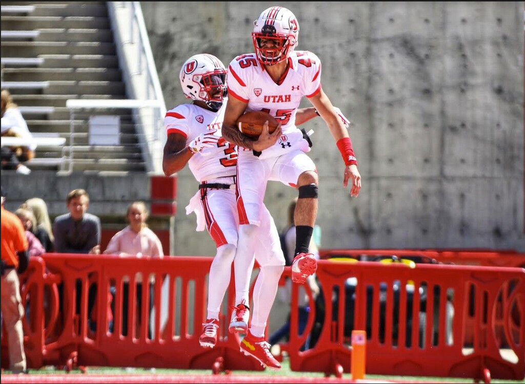 (Photo courtesy of Sarah Shebek, University of Utah) | Utah receiver Samson Nacua celebrates with teammate after scoring touchdown for the White team in Utah's Red-White spring game Saturday.