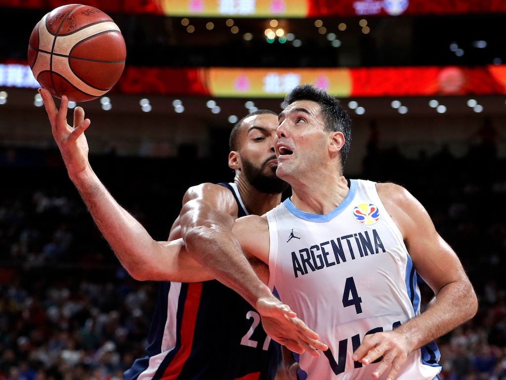 (Mark Schiefelbein | AP Photo) Luis Scola of Argentina is fouled by Rudy Gobert of France as he goes to the basket during their semifinal match in the FIBA Basketball World Cup at the Cadillac Arena in Beijing, Friday, Sept. 13, 2019.