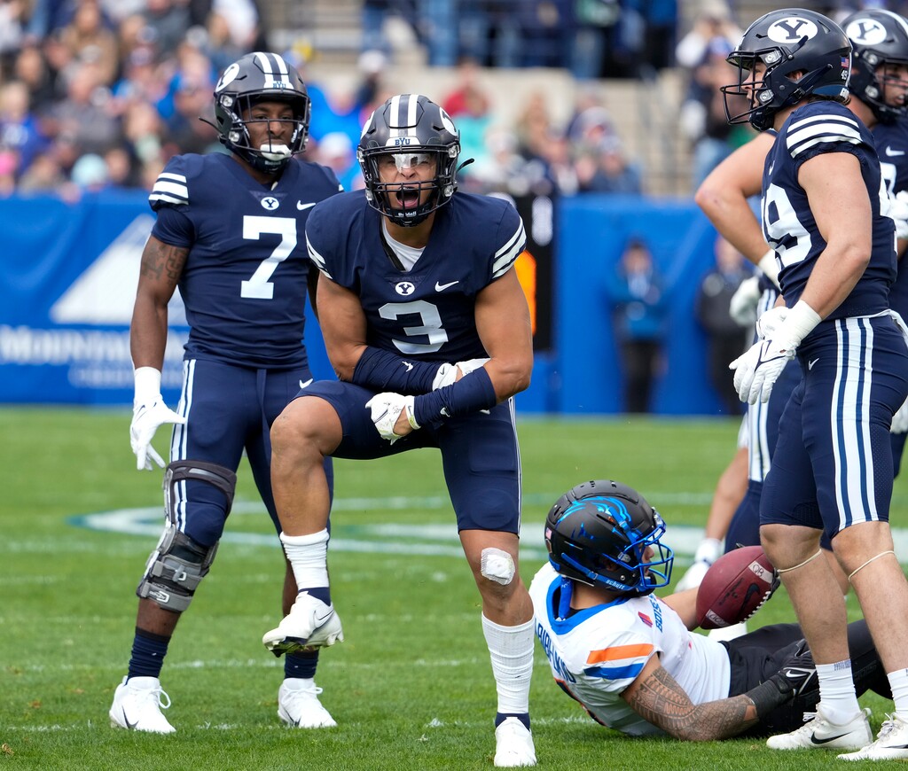 (Leah Hogsten | The Salt Lake Tribune) Brigham Young Cougars linebacker Chaz Ah You (3) celebrates his tackle on Boise State Broncos running back Cyrus Habibi-Likio (4) as No. 10 Brigham Young University hosts Boise State at LaVell Edwards Stadium, Oct. 9, 2021. 