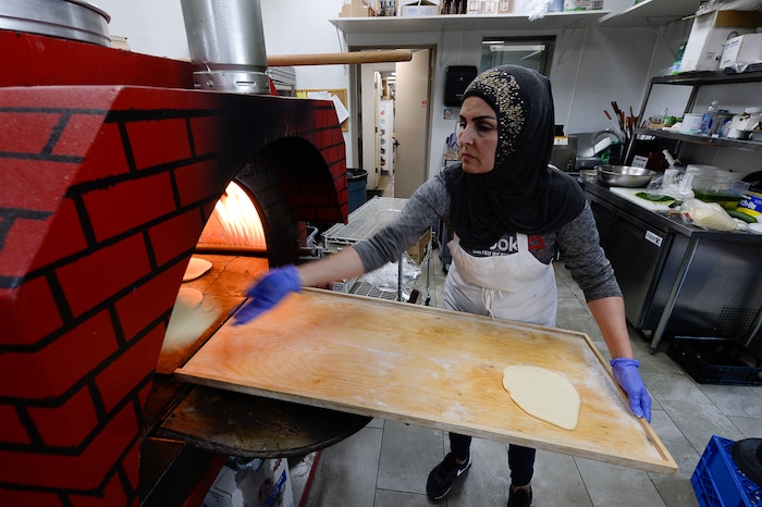 (Francisco Kjolseth  |  The Salt Lake Tribune)  Fatme Haj prepares pita bread at Beirut Cafe in Murray.